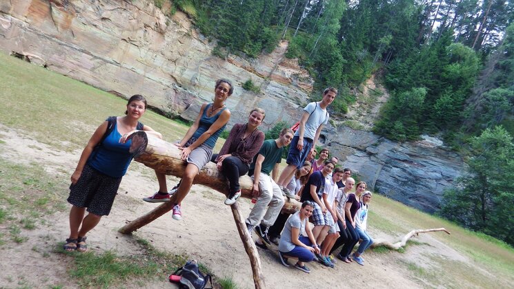 People sitting on a log in Taevaskoda